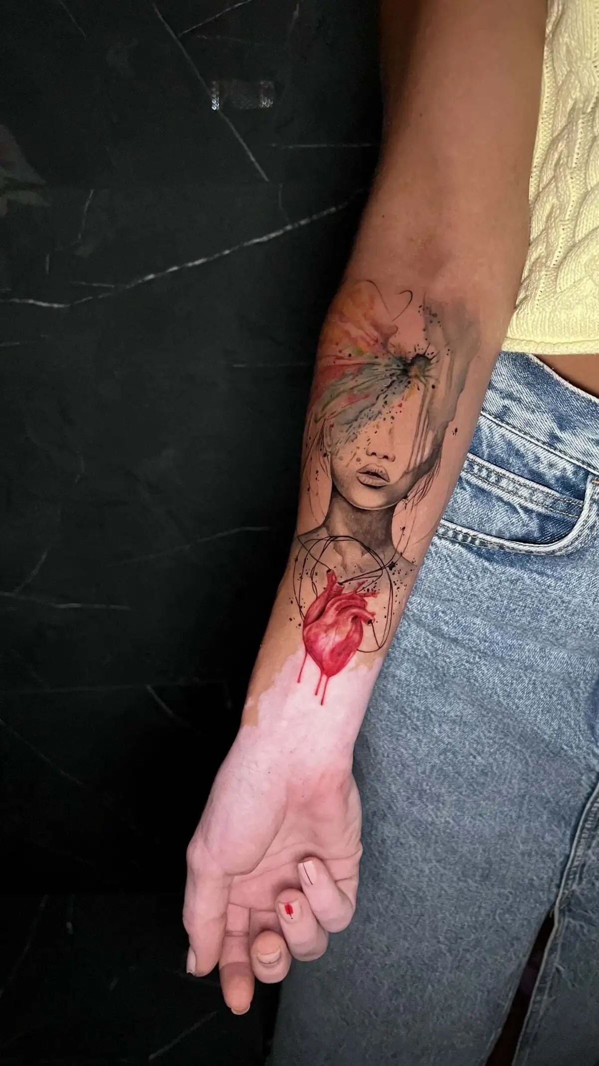 woman anatomical heart watercolor forearm tattoo
