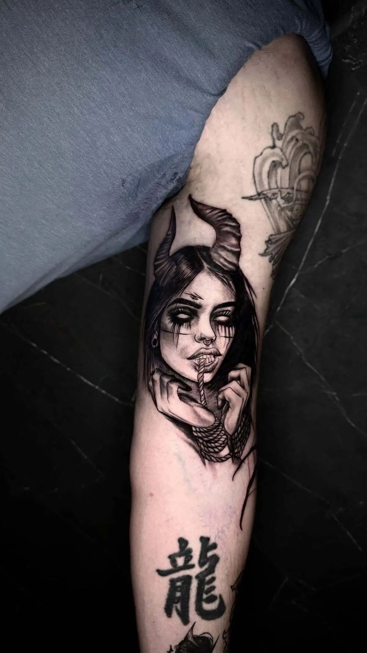 dark fantasy demon woman arm tattoo
