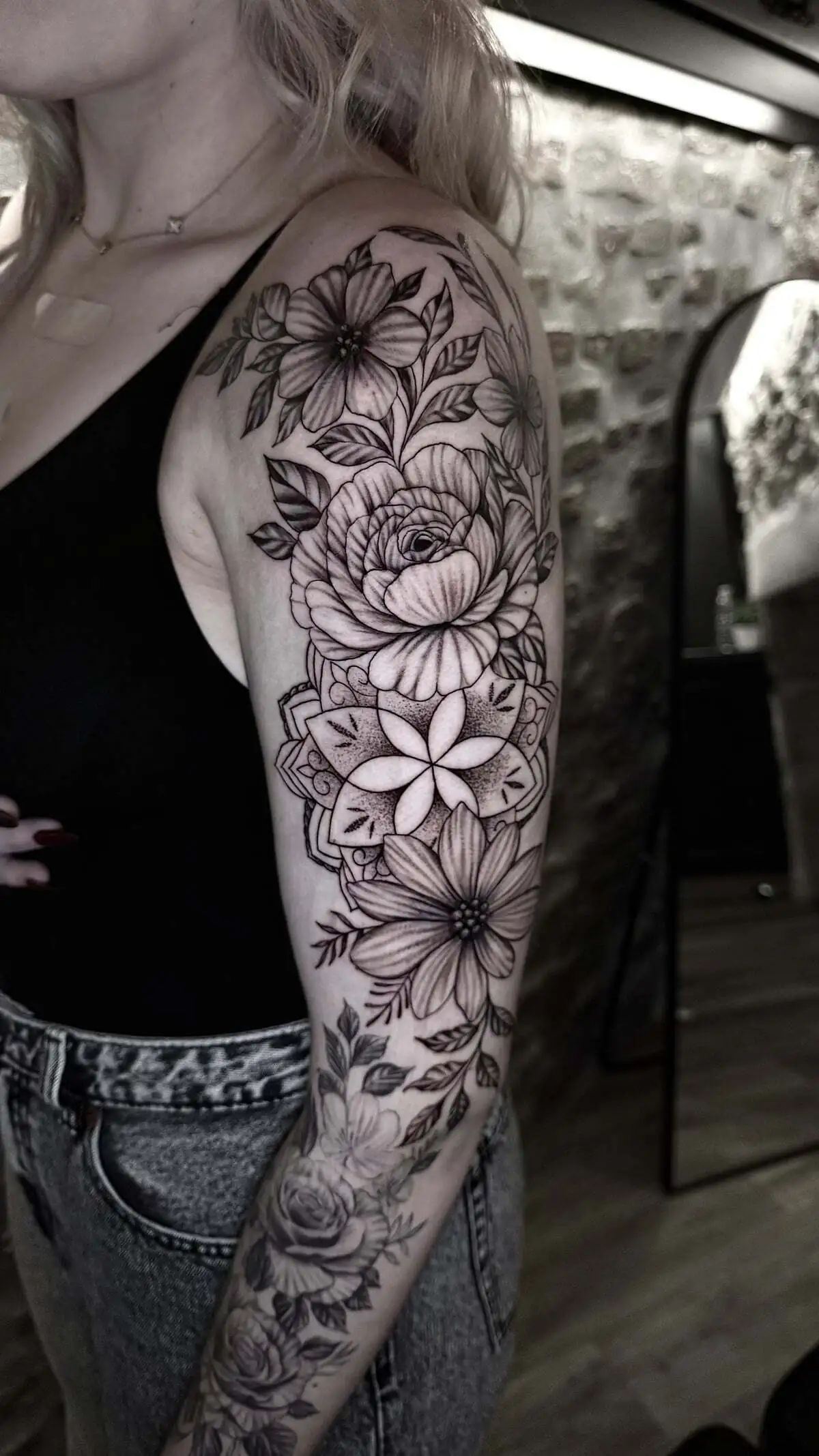 large floral sleeve fine line arm tattoo