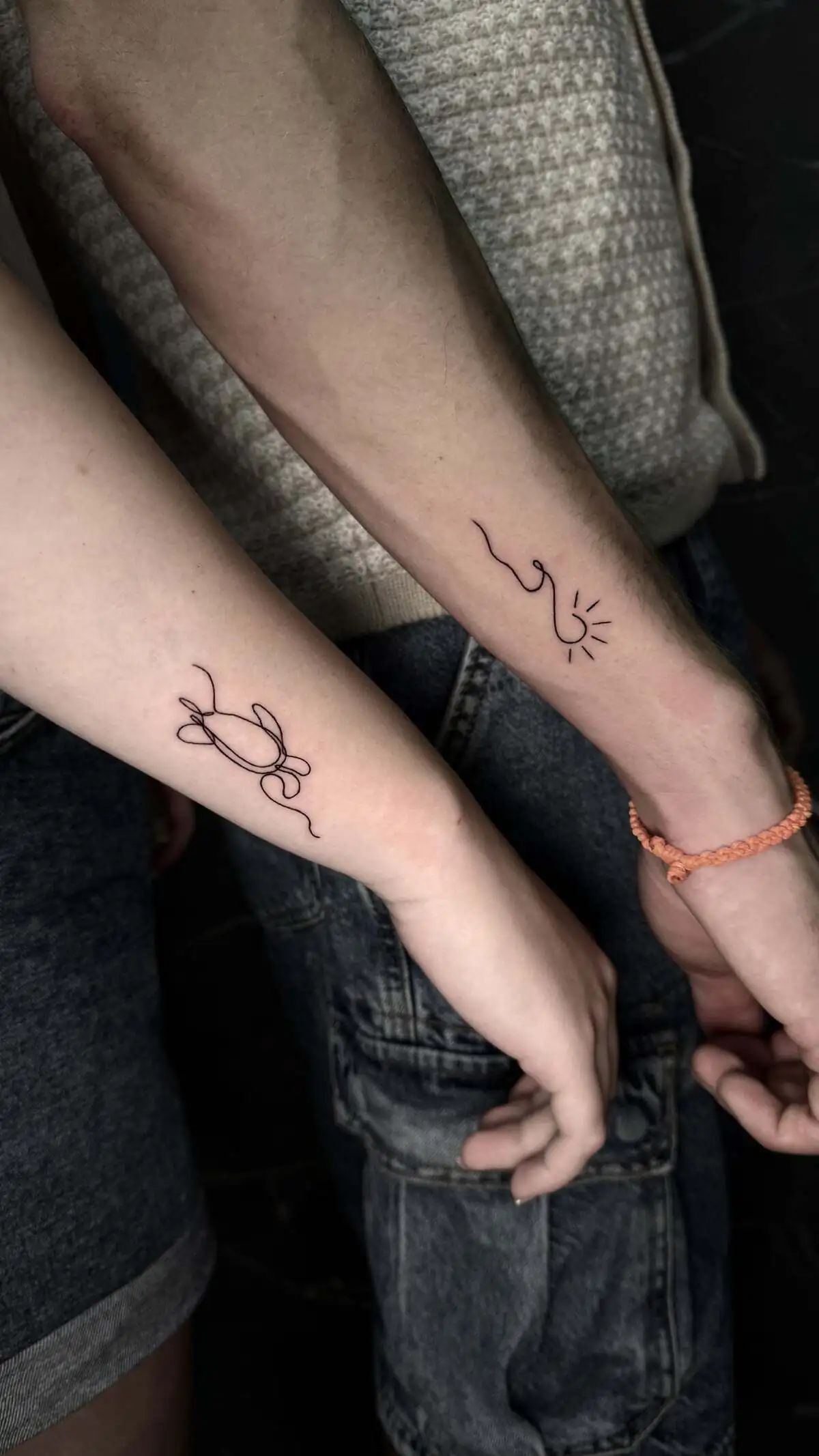matching minimal line couple wrists tattoos