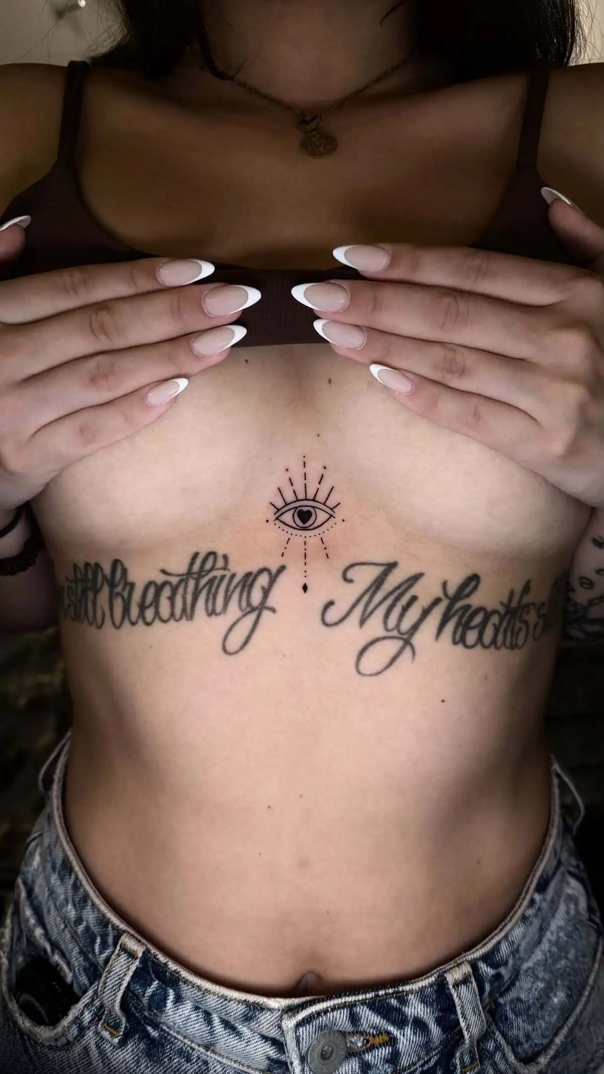 all seeing eye sternum rays tattoo