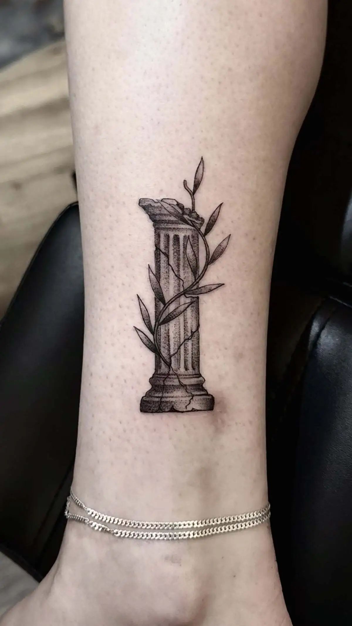 ancient greek column olive branch micro realism ankle tattoo