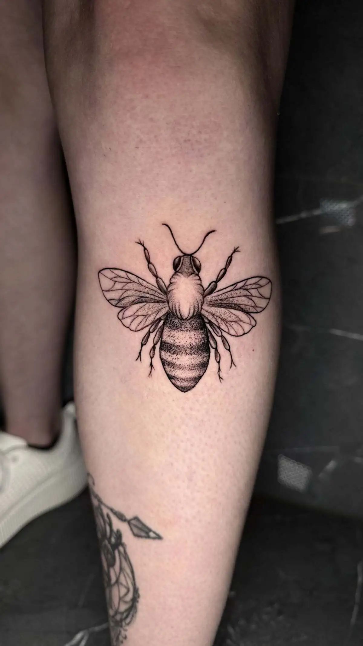 realistic bee micro realism calf tattoo
