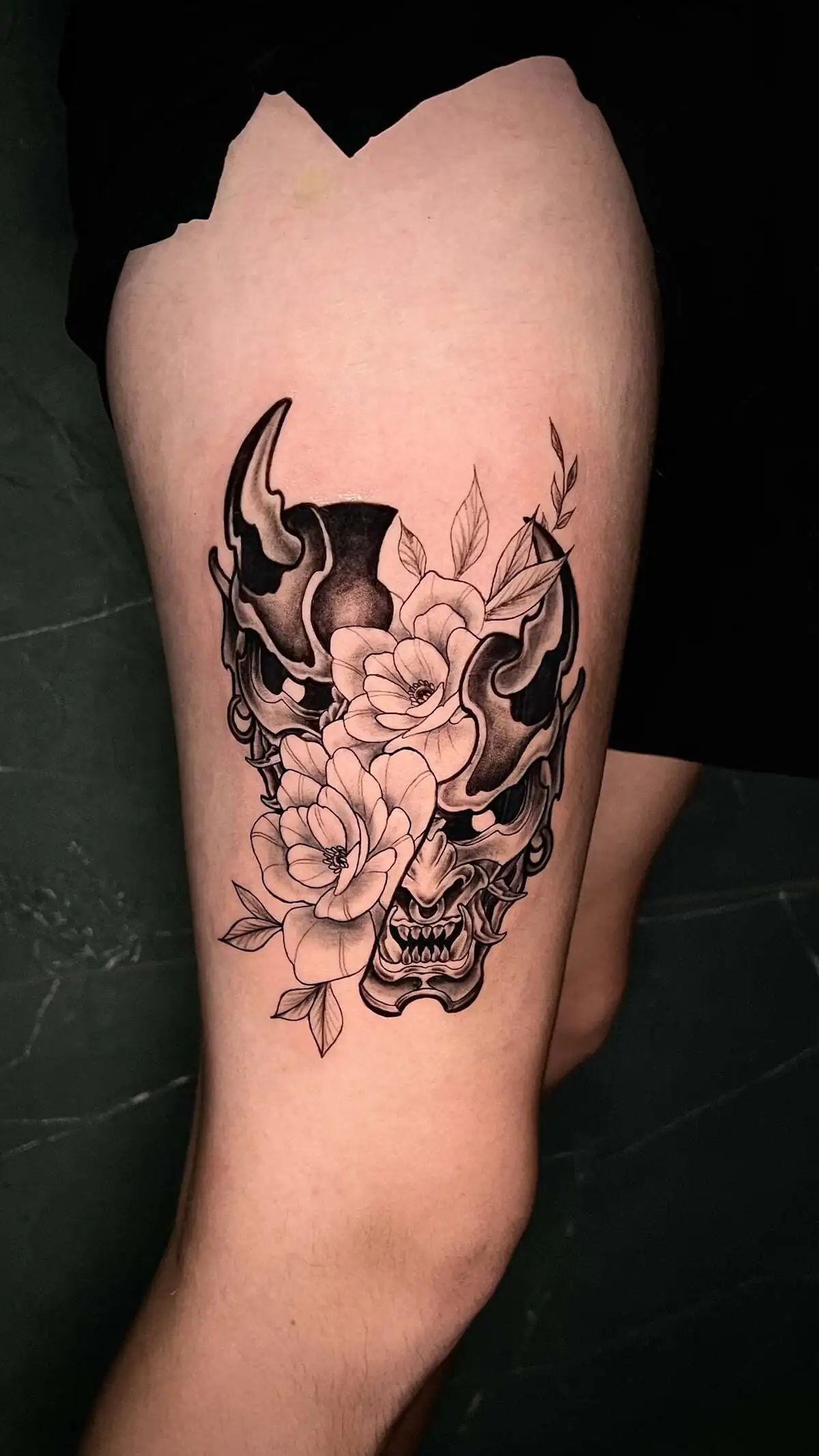 oni mask peony flowers thigh tattoo