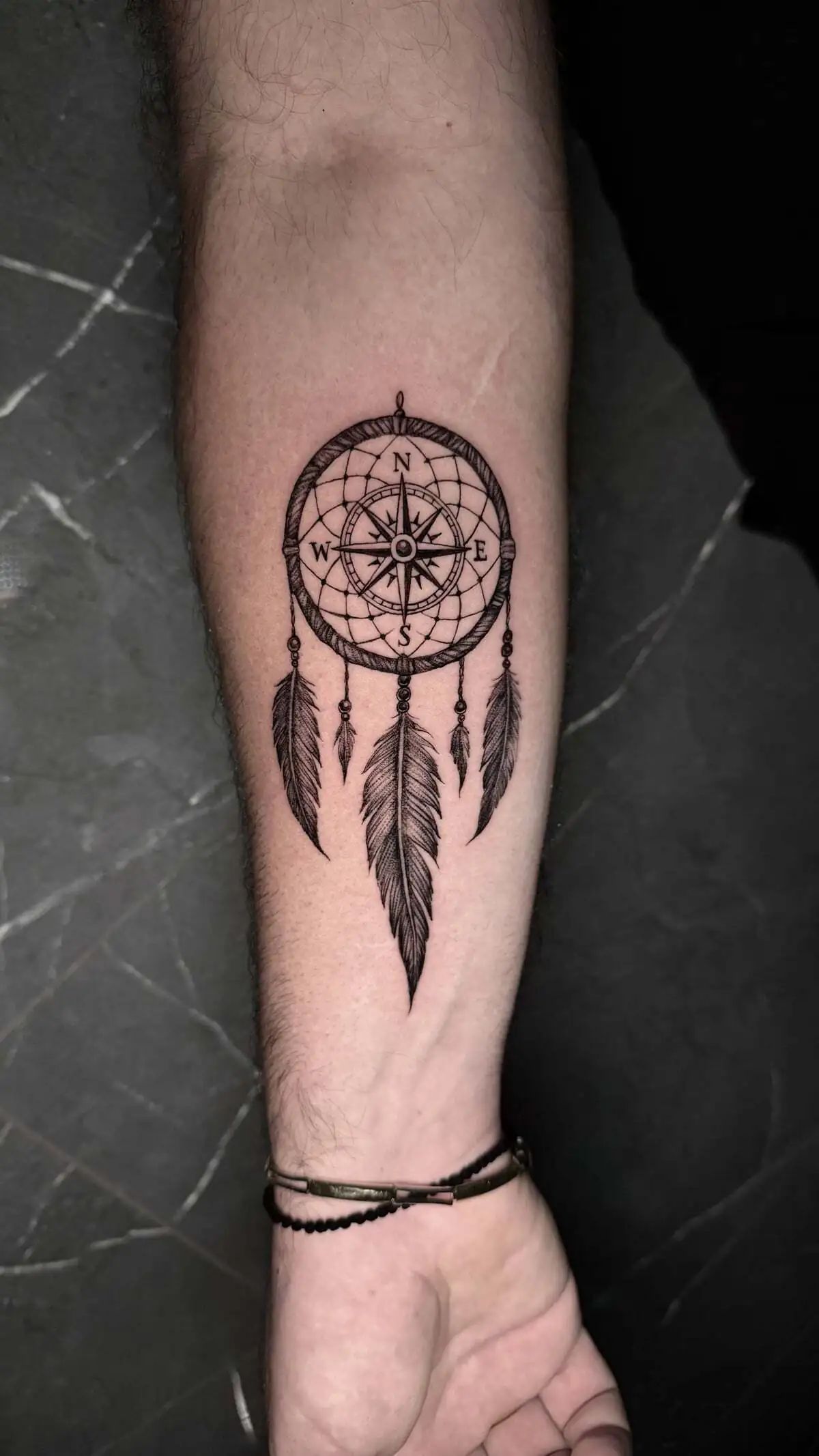 dreamcatcher compass feather forearm tattoo