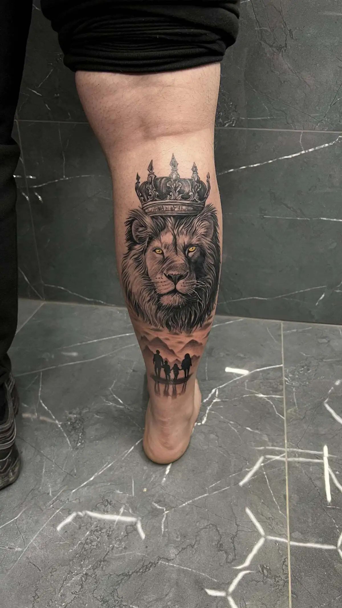 lion crown family silhouette calf tattoo