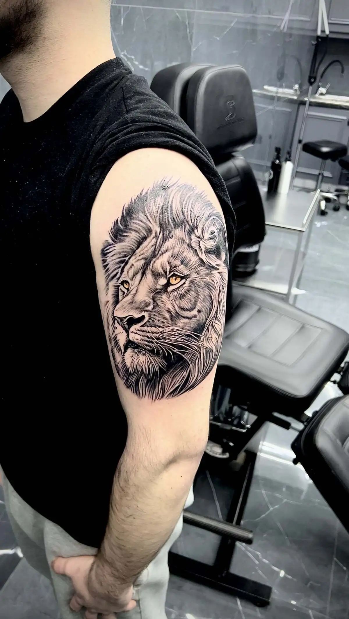lion portrait realistic shoulder tattoo